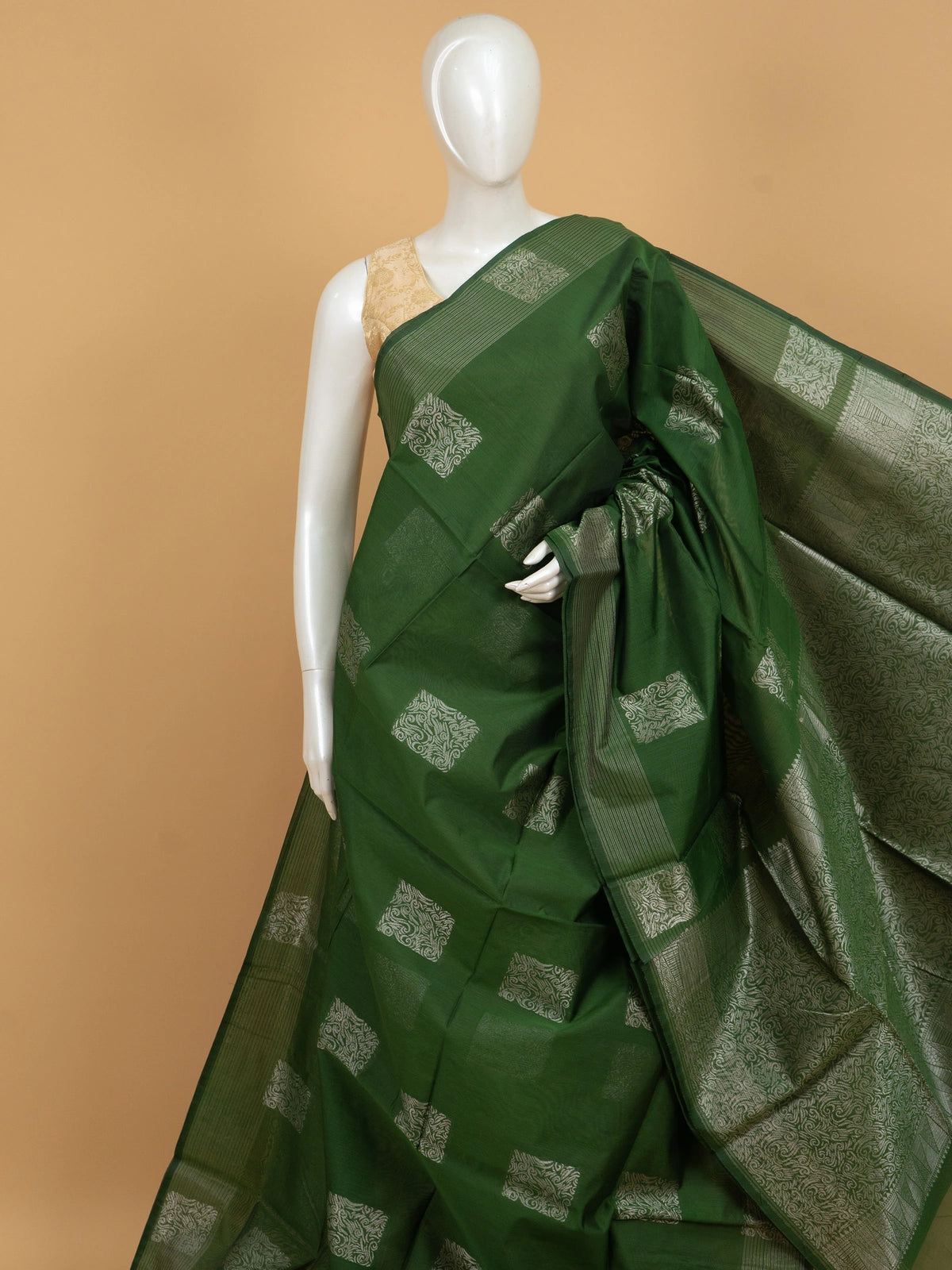 Green silk cotton saree with silver zari square buttas and temple-triangle border