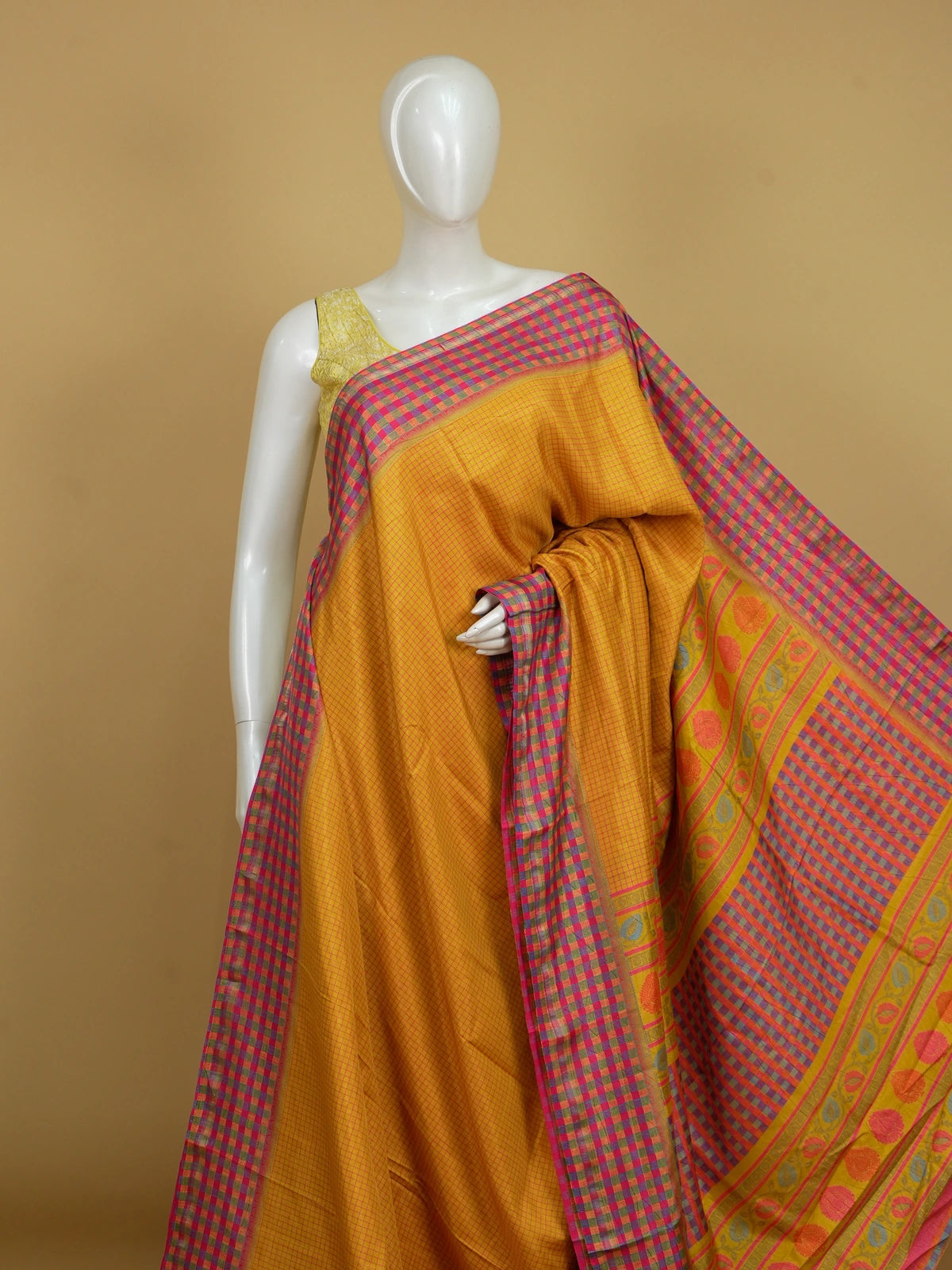 Mustard yellow Dola silk saree with pink checks and contrast multicolour checked border