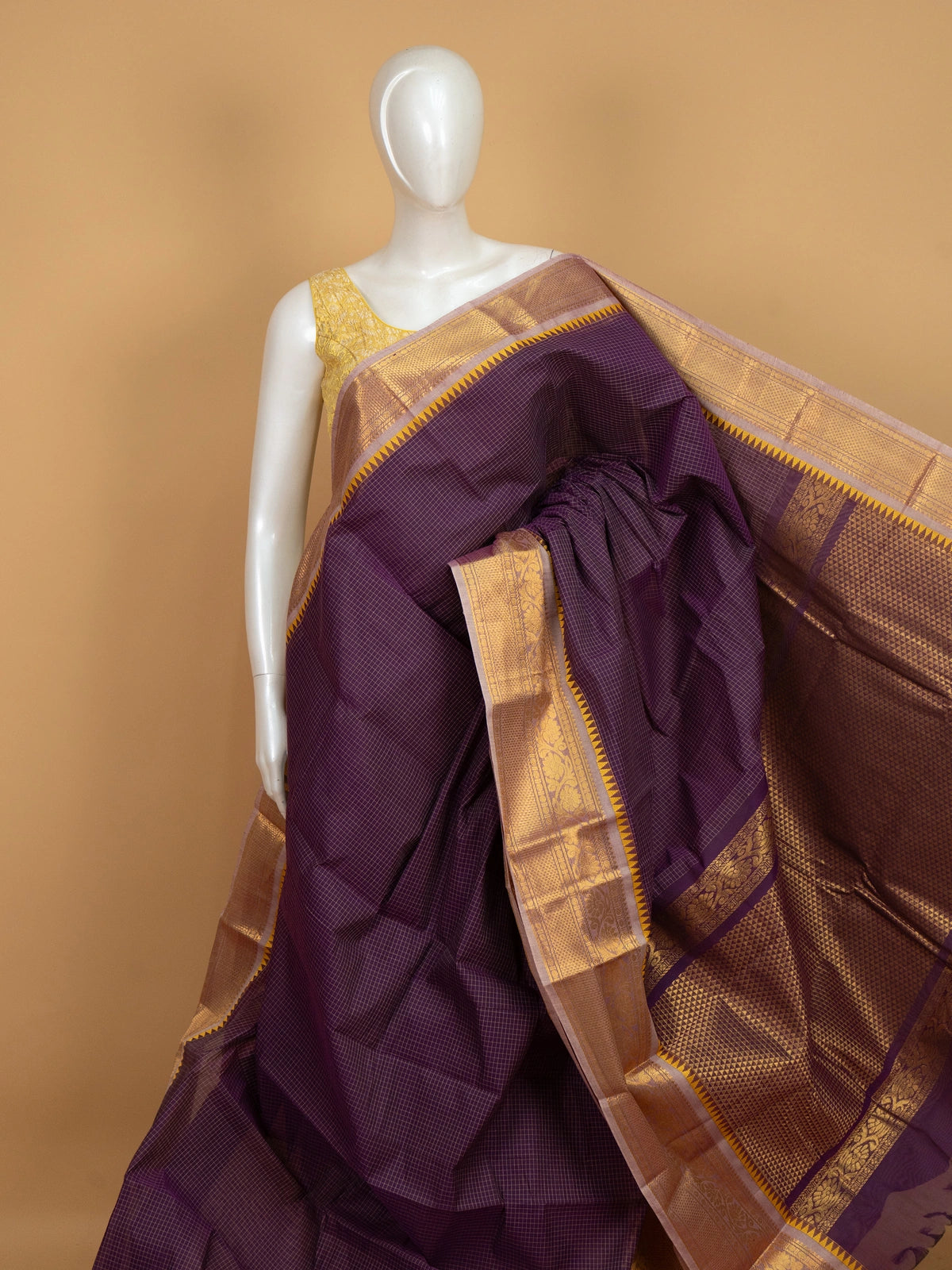 Purple Chettinad cotton saree with gold checked body and temple zari border