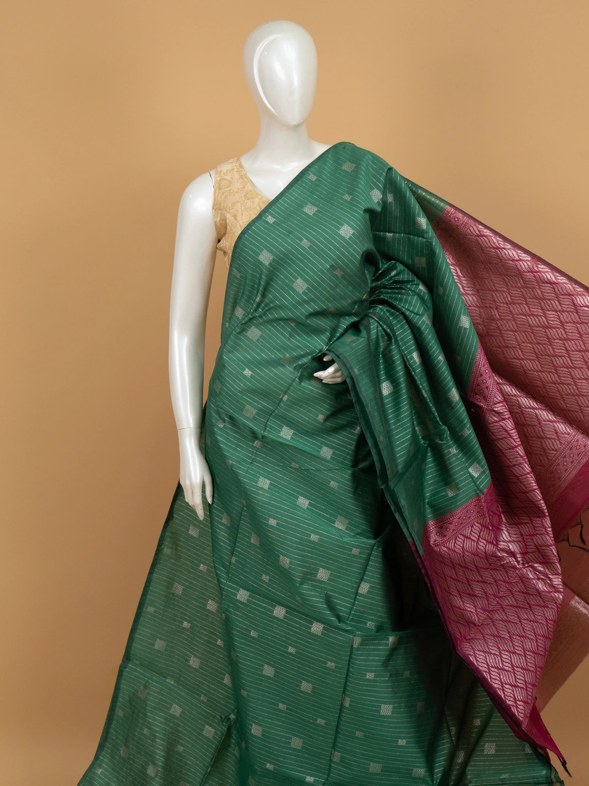 Green silk cotton saree with silver zari stripes and contrast magenta zari border and pallu