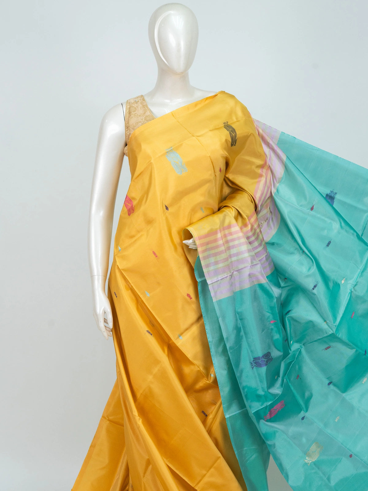 Mustard yellow banana silk saree with turquoise contrast pallu and colourful woven butta motifs