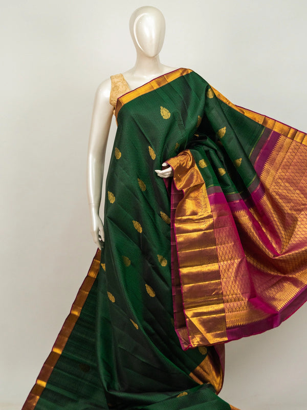 Bottle green pure Kanchipuram silk saree with magenta and gold zari contrast border and zari brocade pallu