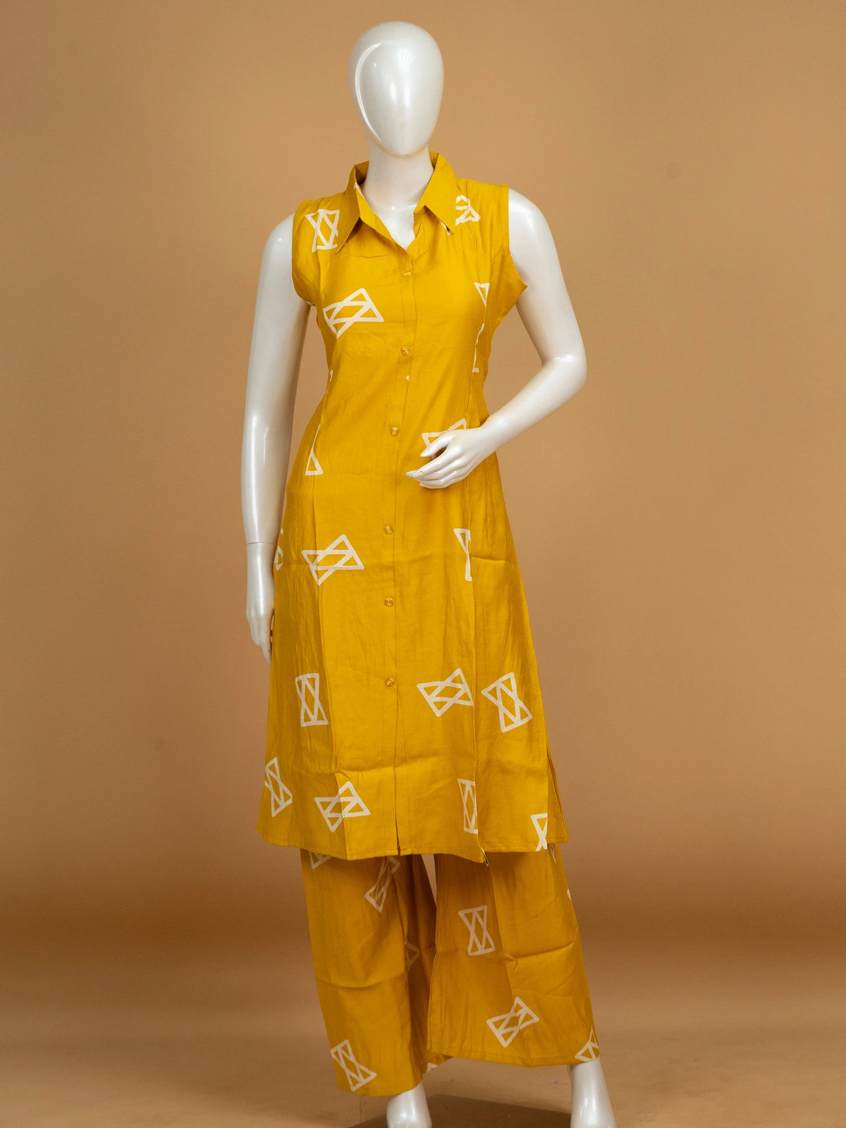Mustard yellow geometric print cotton sleeveless shirt-style kurti with matching palazzo pants co-ord set