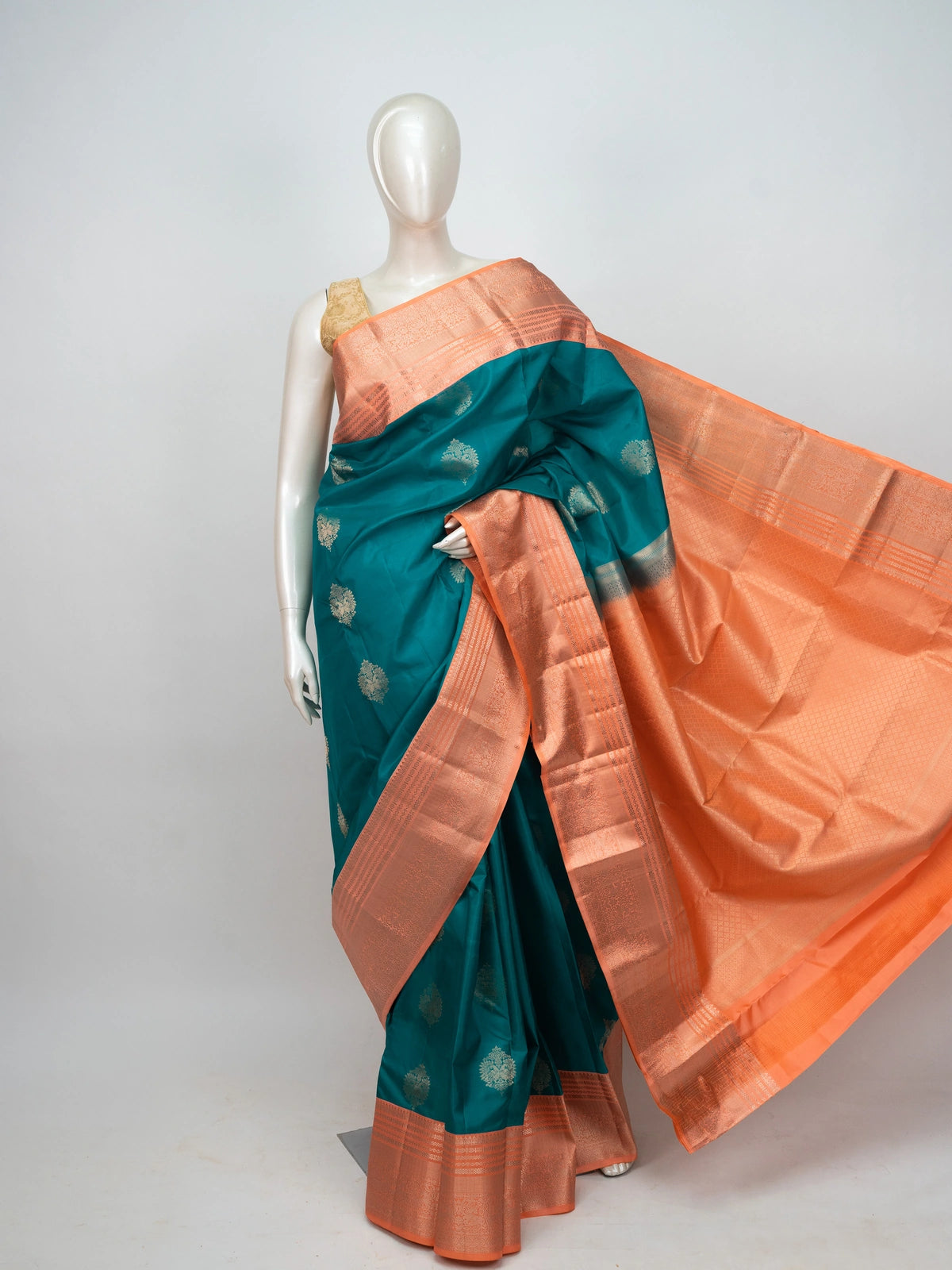 Teal Pure Kanchipuram Silk saree with copper contrast zari border and gold buttas