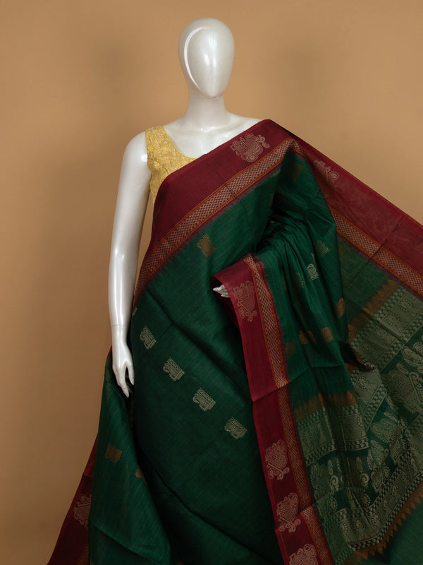 Green semi raw silk saree with contrast maroon zari border and woven pallu motifs