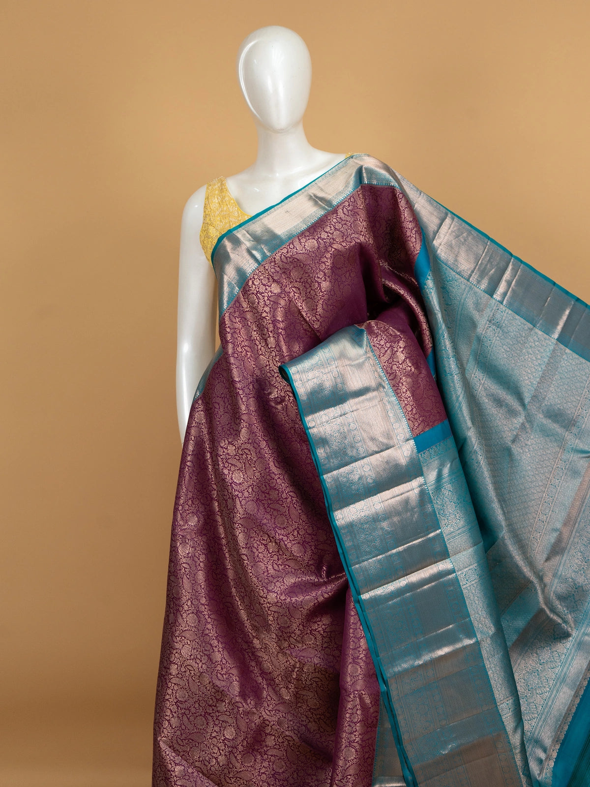 Purple pure Kanchipuram silk saree with silver zari floral weaving and contrast teal blue border and pallu