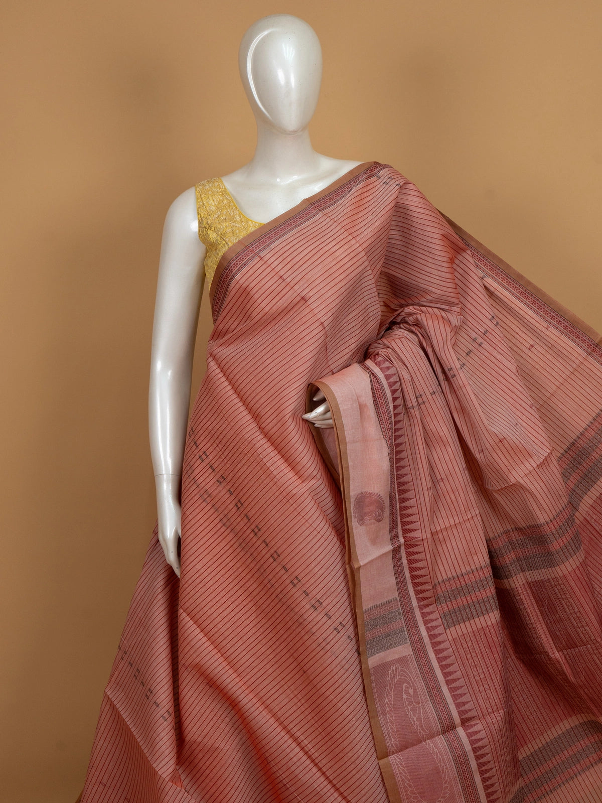 Peach semi raw silk saree with maroon stripes, temple border and paisley pallu