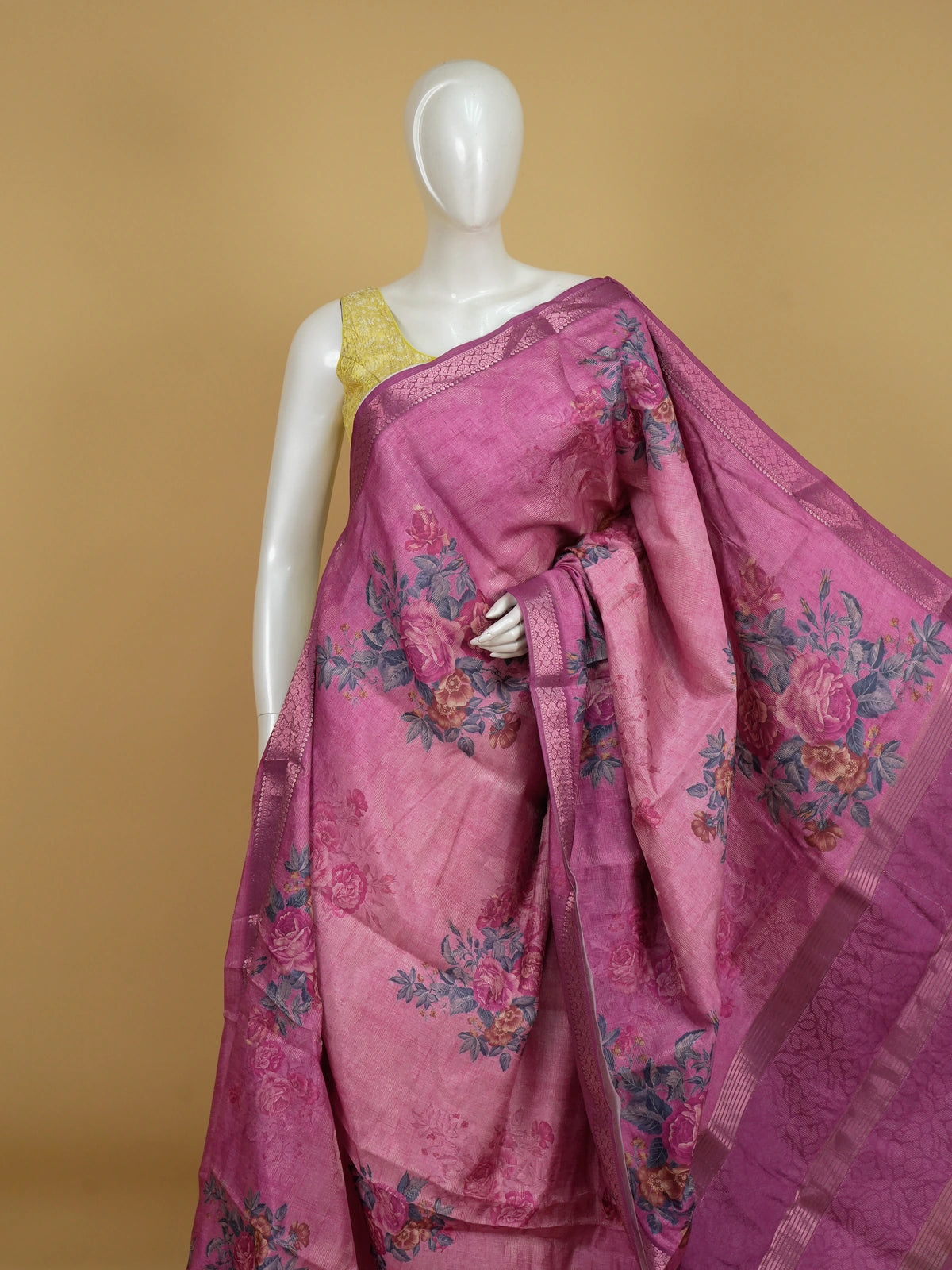 Pink semi tussar saree with floral print body and magenta zari border