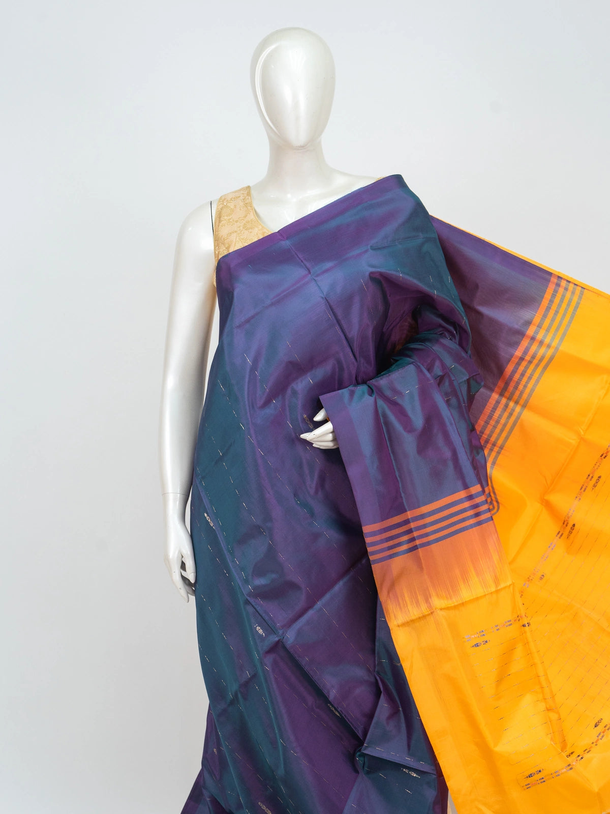 Teal and purple banana silk saree with gold zari stripes and a contrast mustard striped pallu