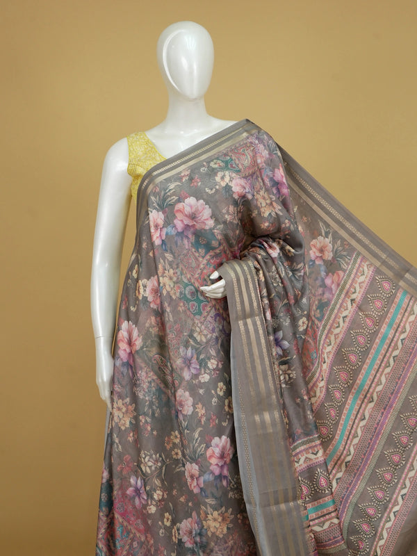 Grey organza designer saree with multicoloured floral print and gold zari border