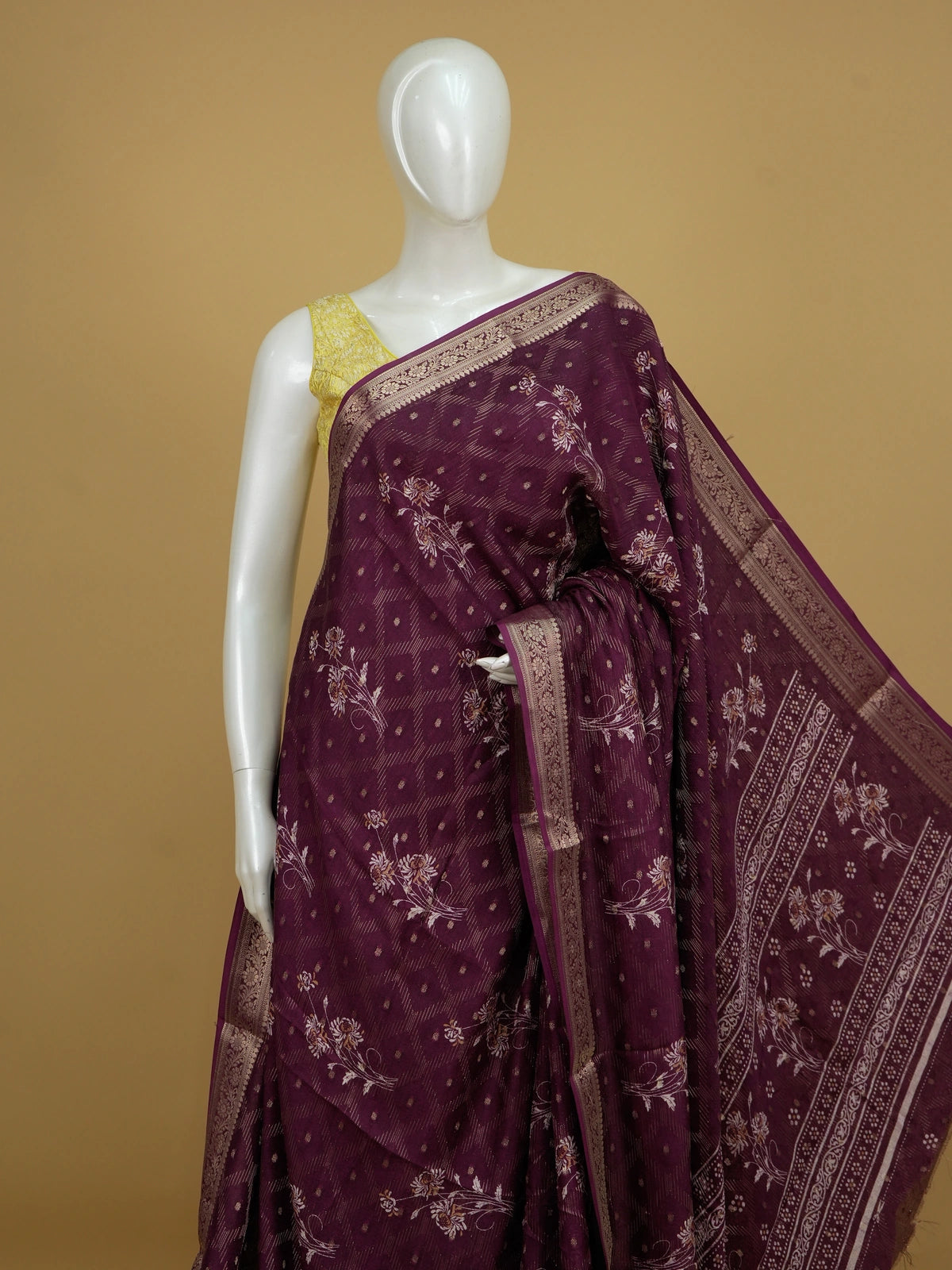 Wine purple art silk designer saree with floral prints, gold zari buttis and contrast zari border