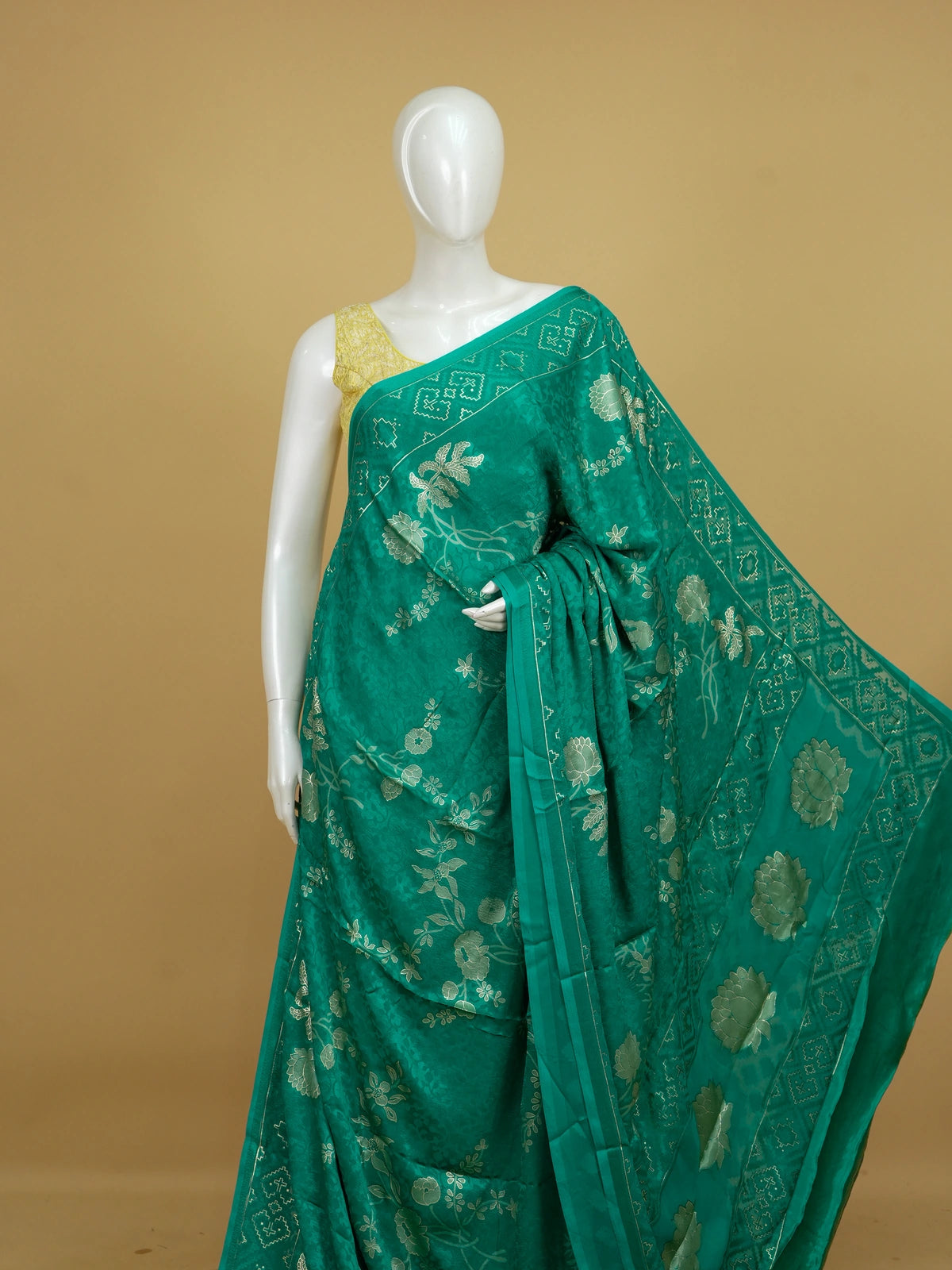 Sea green designer saree with tonal floral weave, lotus pallu motifs and patola-style border