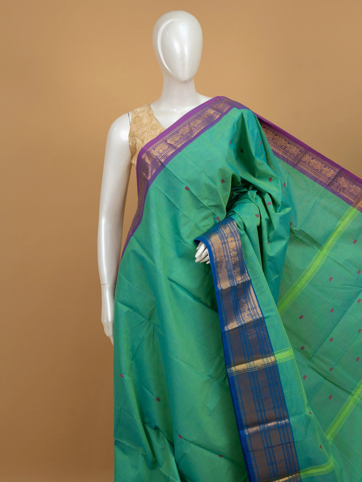 Green Chettinad cotton saree with contrast purple and blue zari borders and pink buttas