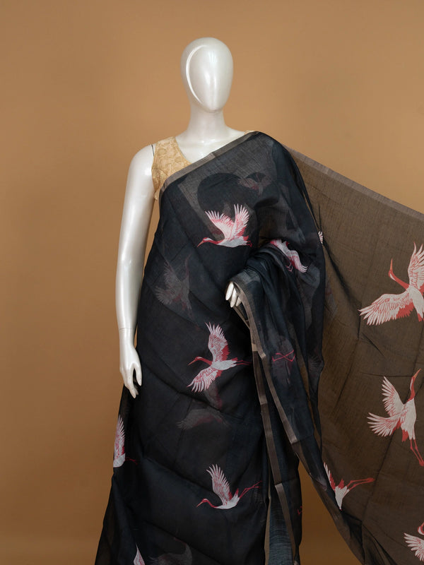 Black linen cotton saree with red and white crane prints, tonal circle motifs and a silver zari border