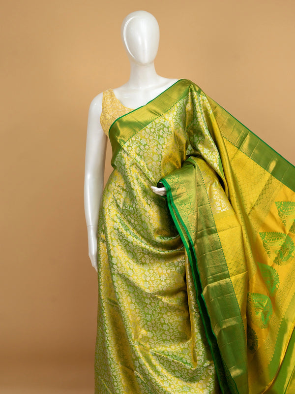Parrot green and gold pure Kanchipuram silk saree with floral zari jaal and contrast green border