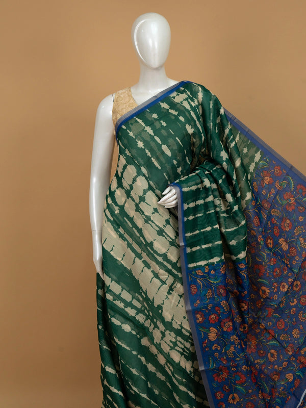 Green shibori linen cotton saree with contrast blue Kalamkari floral pallu and matching blouse