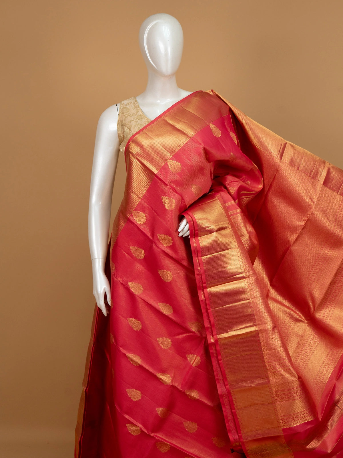 Pink and gold pure Kanchipuram silk saree with gold zari buttis, wide contrast border and woven zari pallu
