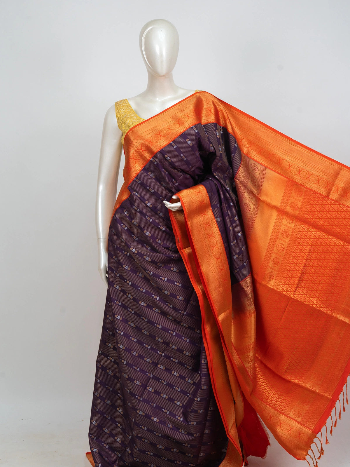 Purple Kanchipuram fancy silk saree with contrast orange gold zari border and brocade pallu