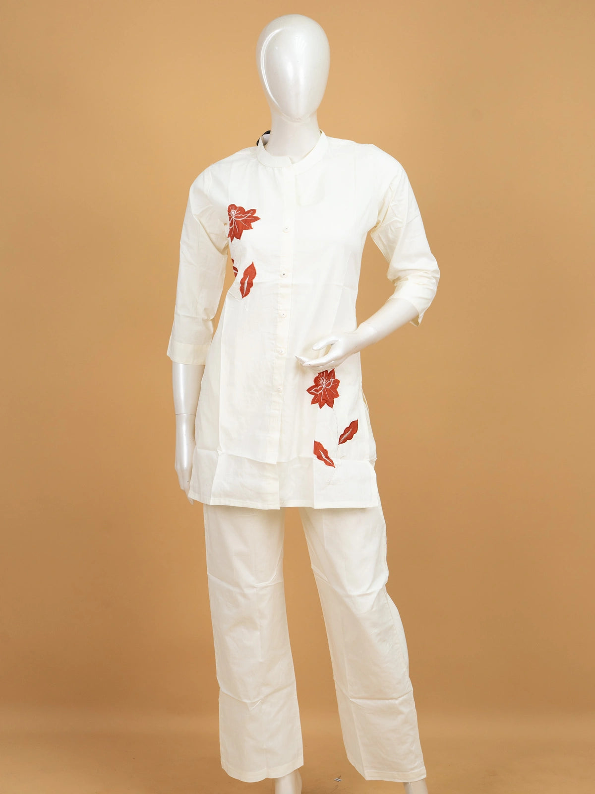 Off-white cotton co-ord set kurti with rust-red floral appliqué and straight pants