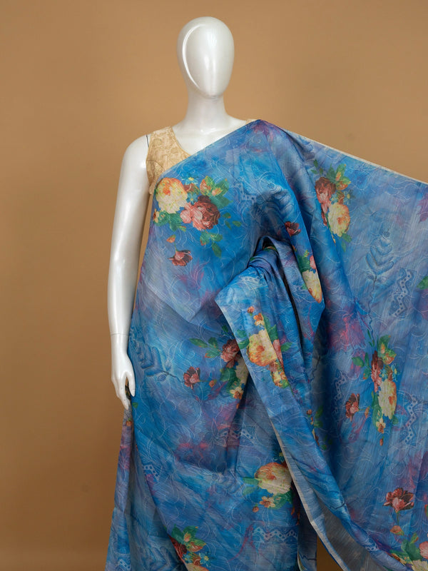 Blue linen cotton saree with multicolour floral print and slim silver-edged border