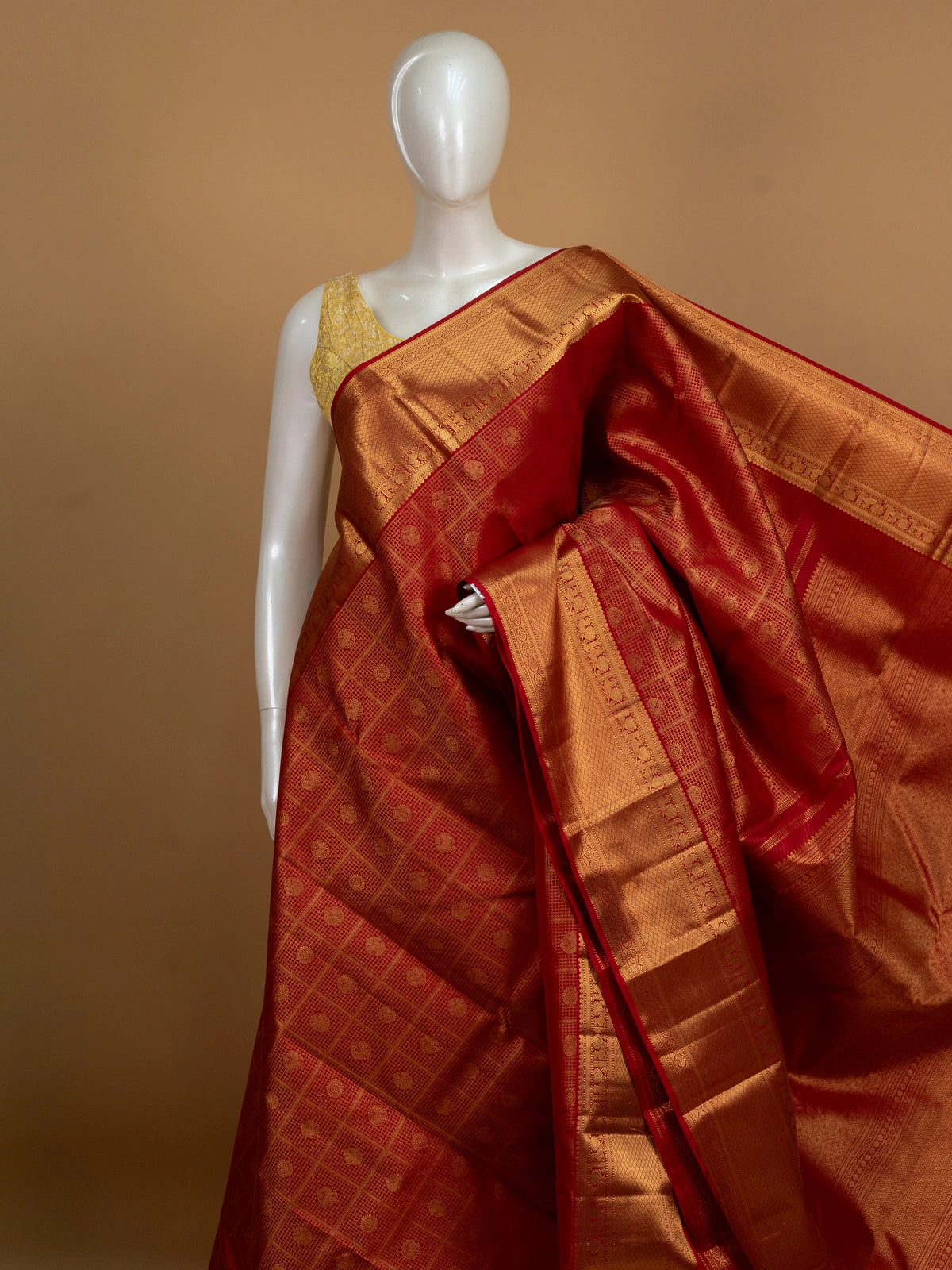 Red pure Kanchipuram silk saree with checked body, gold zari border and ornate zari pallu