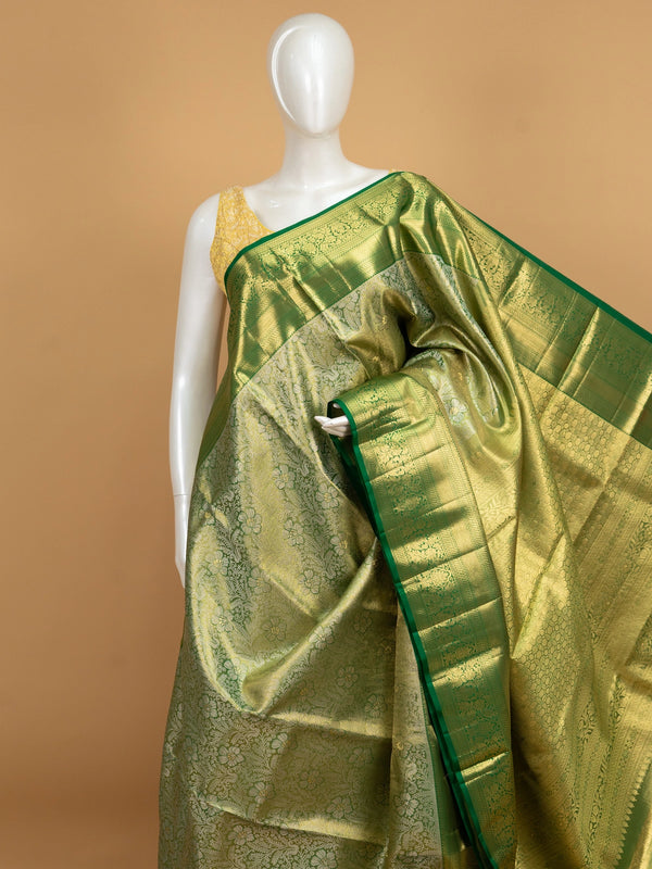 Green pure Kanchipuram silk saree with gold zari floral motifs and contrast border