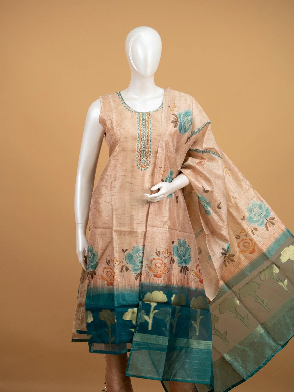 Beige floral raw silk straight cut kurti set with mirror work neckline, teal border and matching dupatta
