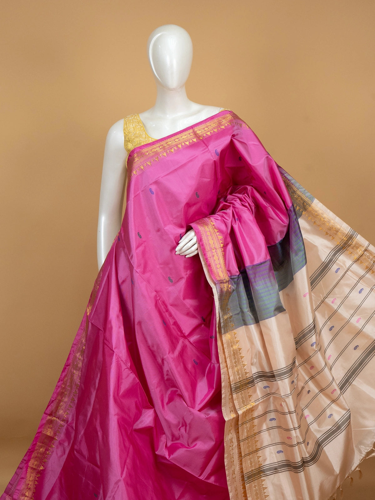 Pink Banana Silk saree with blue paisley butta, gold zari border and contrast cream striped pallu