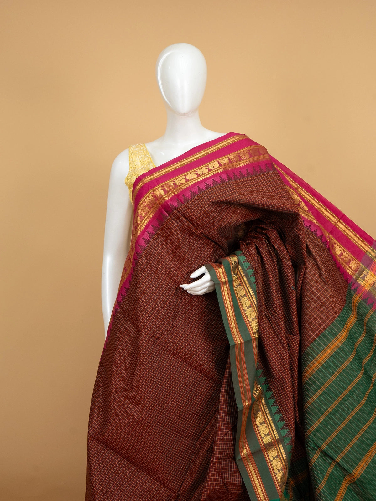 Maroon Chettinad cotton saree with fine checks, pink gold zari border and green striped pallu