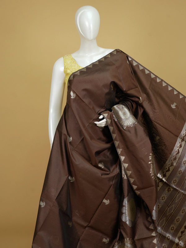 Brown semi tussar saree with gold and silver zari buttas, temple border and floral medallion pallu