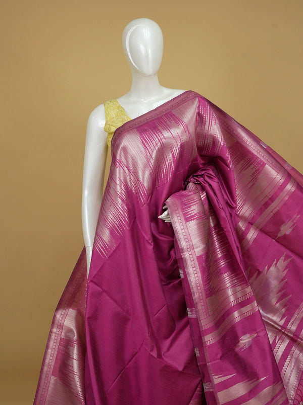Magenta pink semi tussar saree with silver zari ikat streaks and temple-design pallu