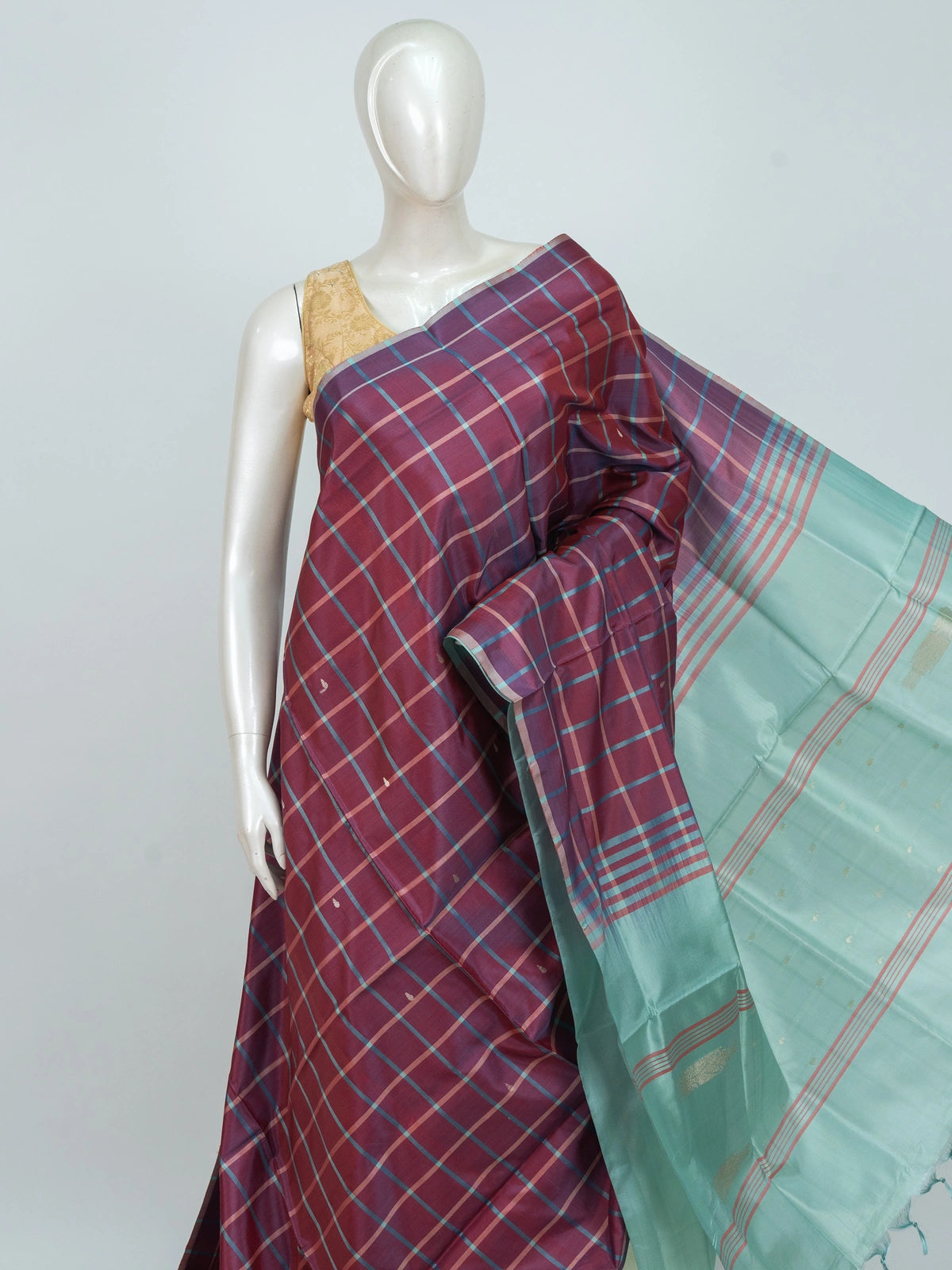 Wine maroon checked banana silk saree with contrast sea-green pallu, gold zari buttas and border