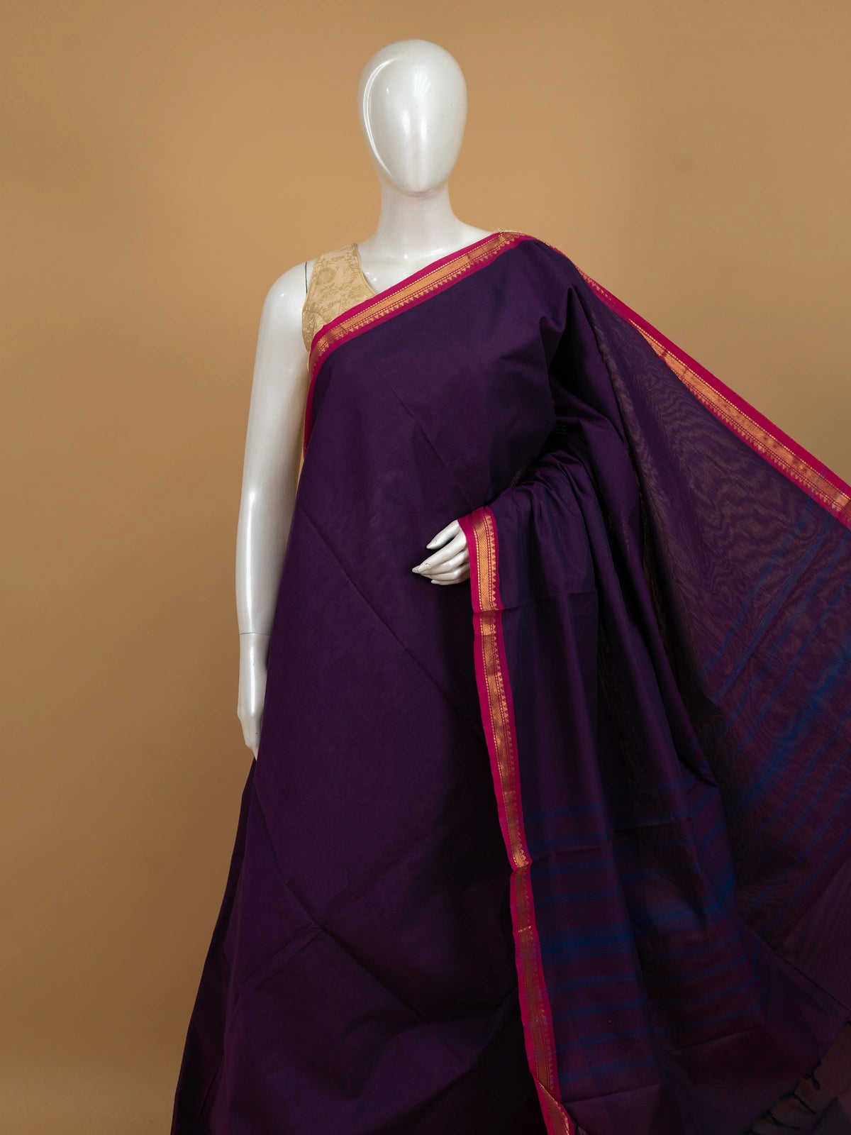 Purple Chettinad cotton saree with pink gold zari temple-motif border and blue-striped pallu