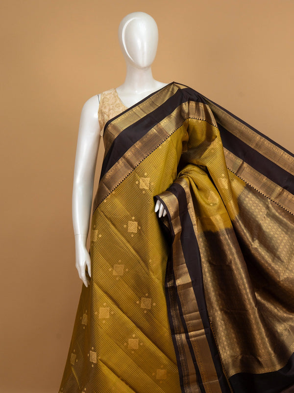 Mehndi green pure Kanchipuram silk saree with dark brown gold zari border and brocade pallu