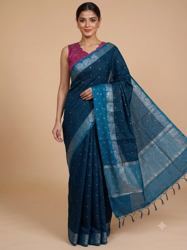Teal blue semi raw silk saree with silver zari buttis and floral zari border