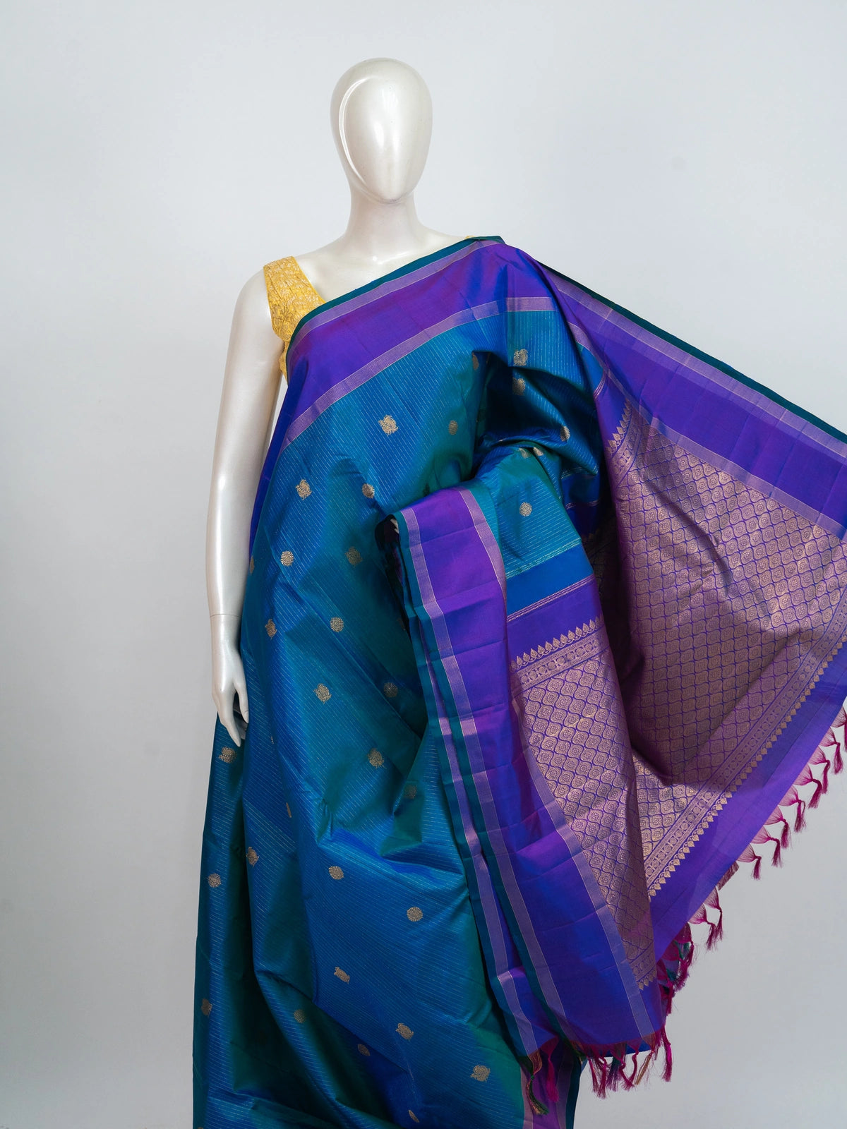 Peacock blue pure Kanchipuram silk saree with contrast purple gold zari border and brocade pallu
