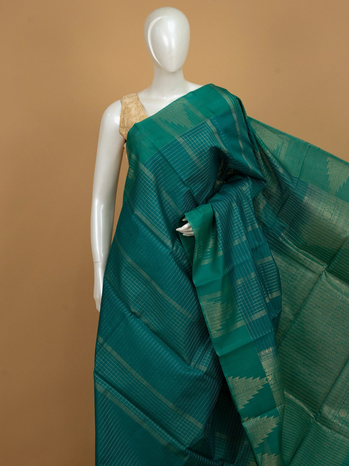 Teal green pure silk cotton saree with gold zari checks and contrast temple zari border
