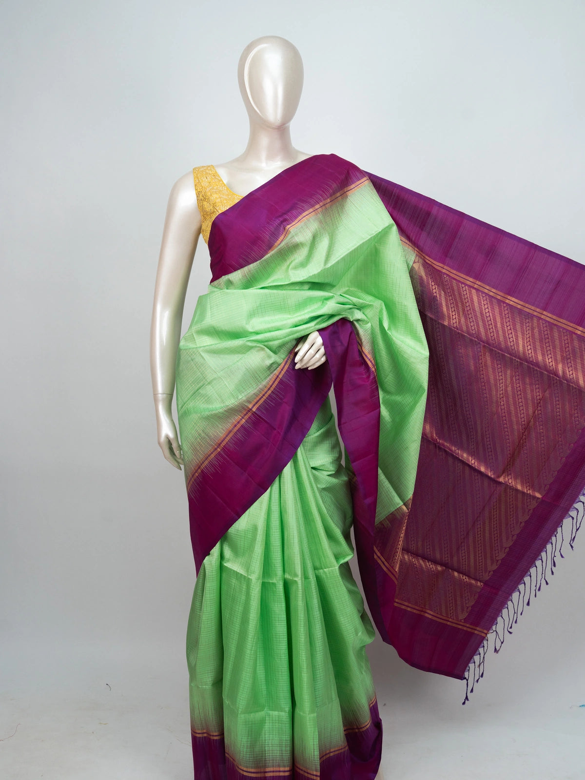 Parrot green soft silk saree with contrast magenta zari border and pallu
