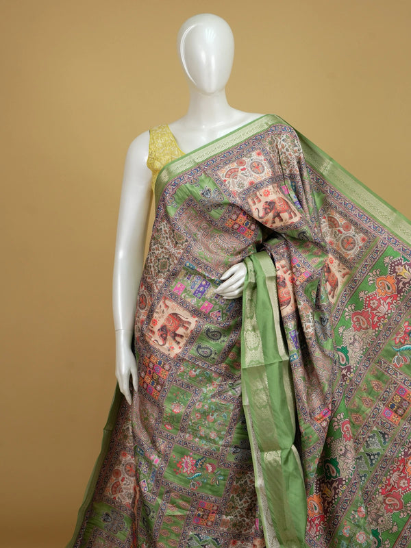 Green multicolour patchwork print Dola silk saree with elephant motifs and contrast zari border