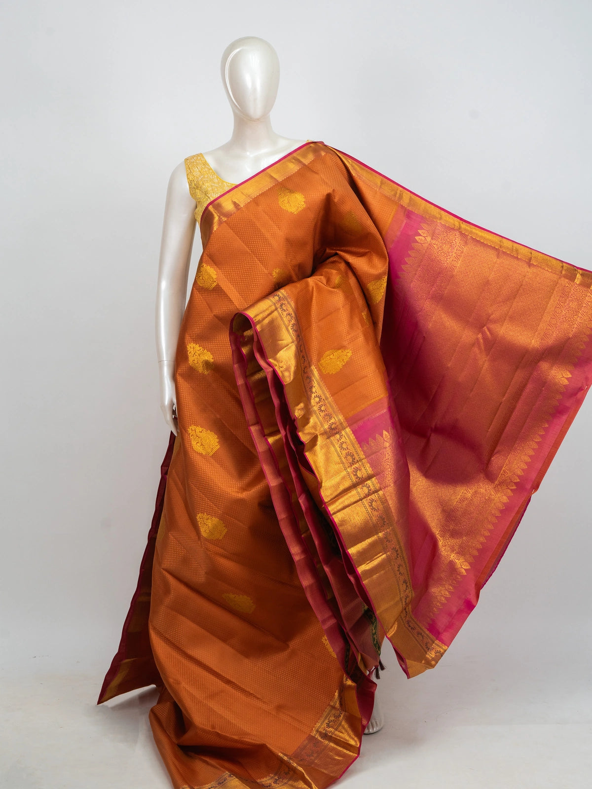 Rust orange pure Kanchipuram silk saree with pink and gold zari contrast border and woven pallu