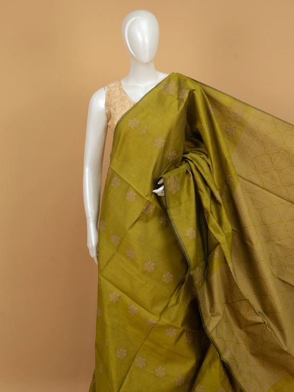 Olive green silk cotton saree with cream woven floral buttas and decorative border