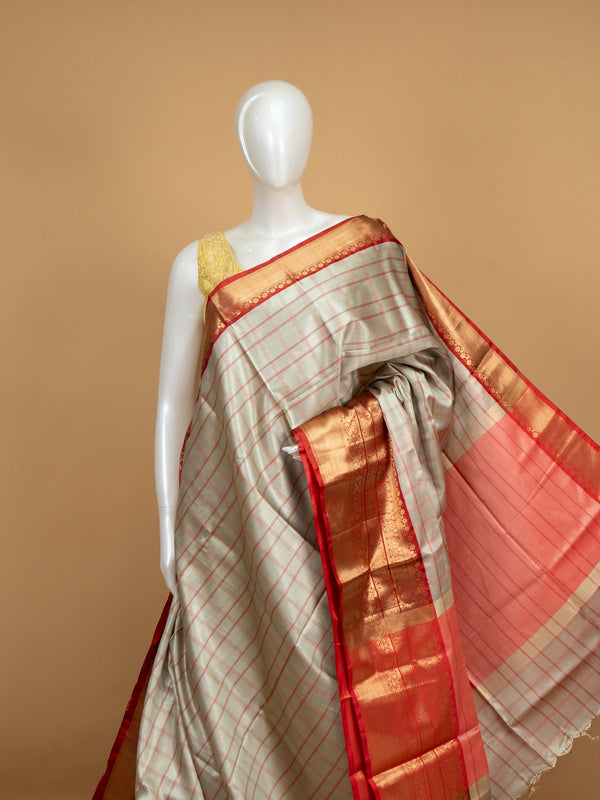 Grey and red checked Kanchi semi silk saree with gold zari border and peach pallu