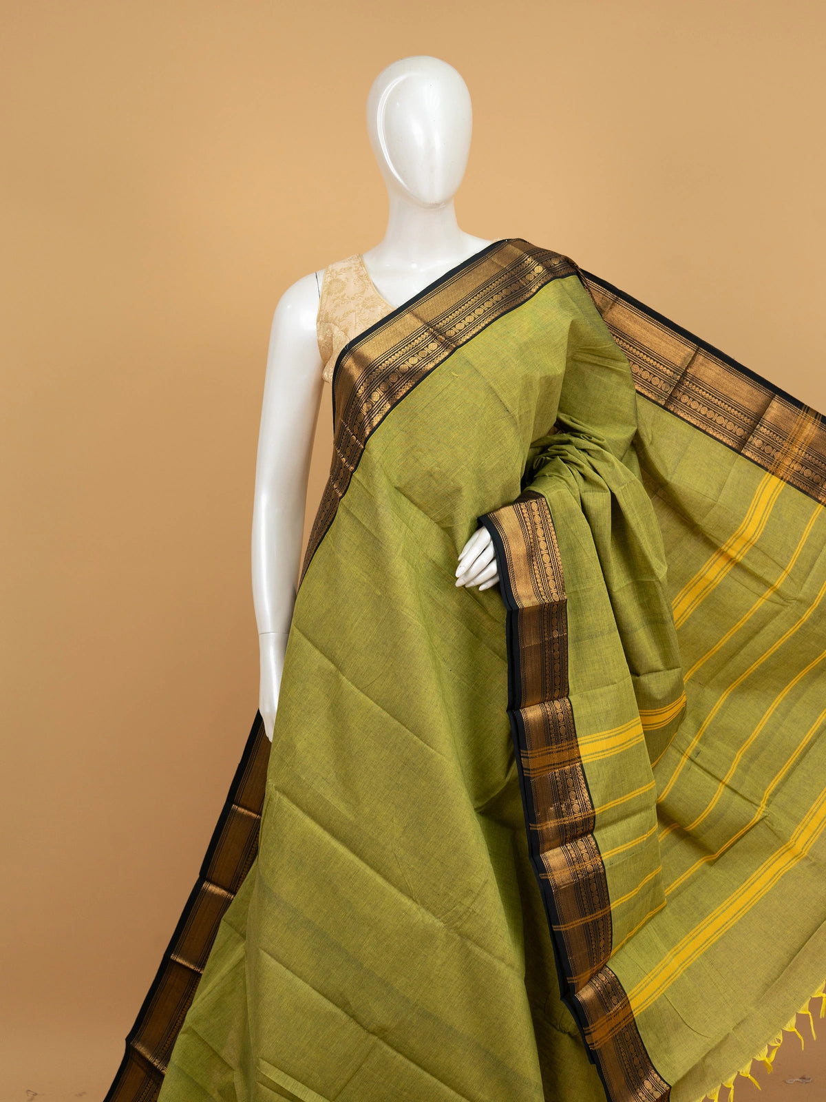 Mehndi green Chettinad cotton saree with black and gold zari border and striped yellow pallu