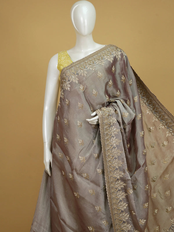 Mauve-grey shimmer designer saree with gold zari and sequin leaf embroidery and scalloped border