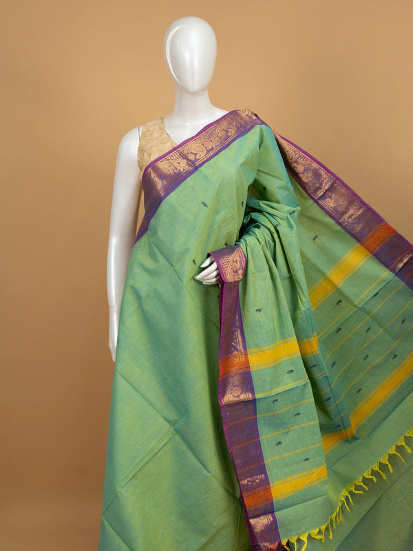 Green Chettinad cotton saree with contrast purple gold zari border and striped pallu
