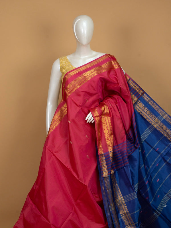 Pink banana silk saree with royal blue contrast pallu and gold zari peacock border