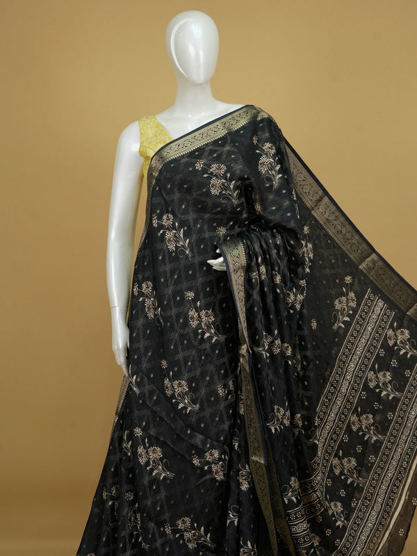 Black designer georgette saree with gold zari border and floral printed body