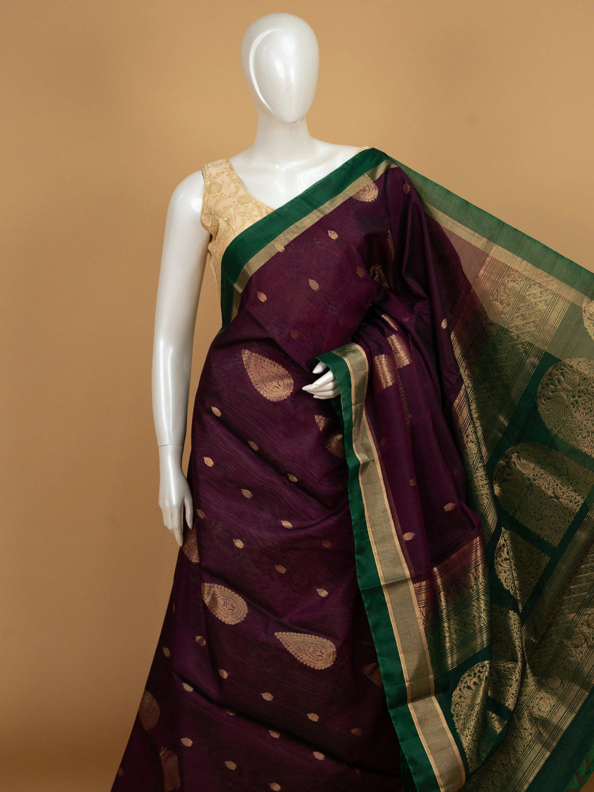 Purple pure silk cotton saree with contrast green zari border and gold peacock motif pallu