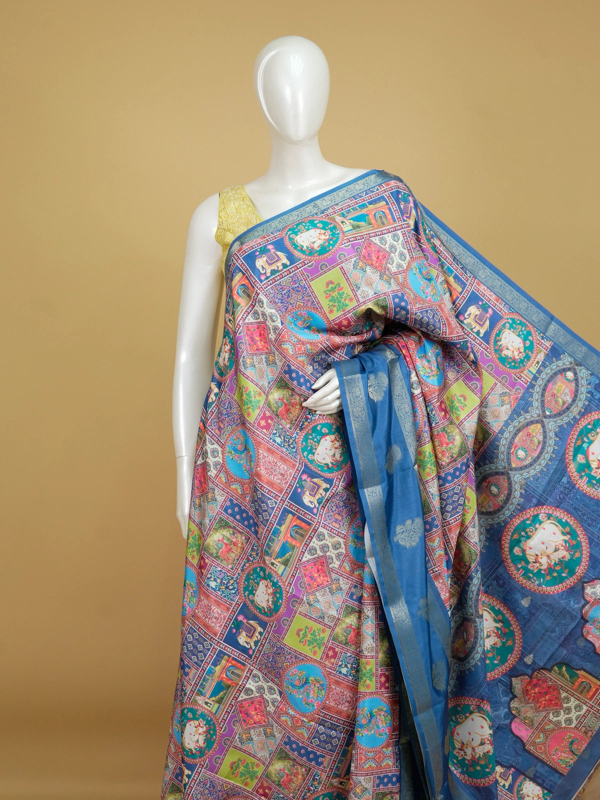 Multicolour Dola silk saree with Pichwai patchwork print and contrast blue zari border
