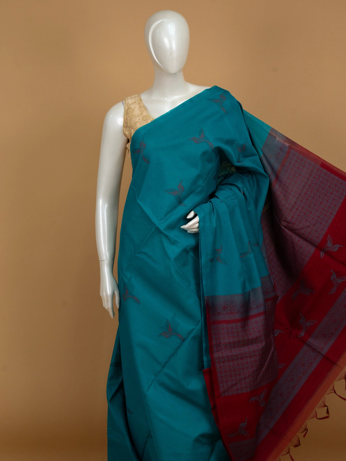 Teal blue pure silk cotton saree with woven bird motifs and contrast red pallu and border